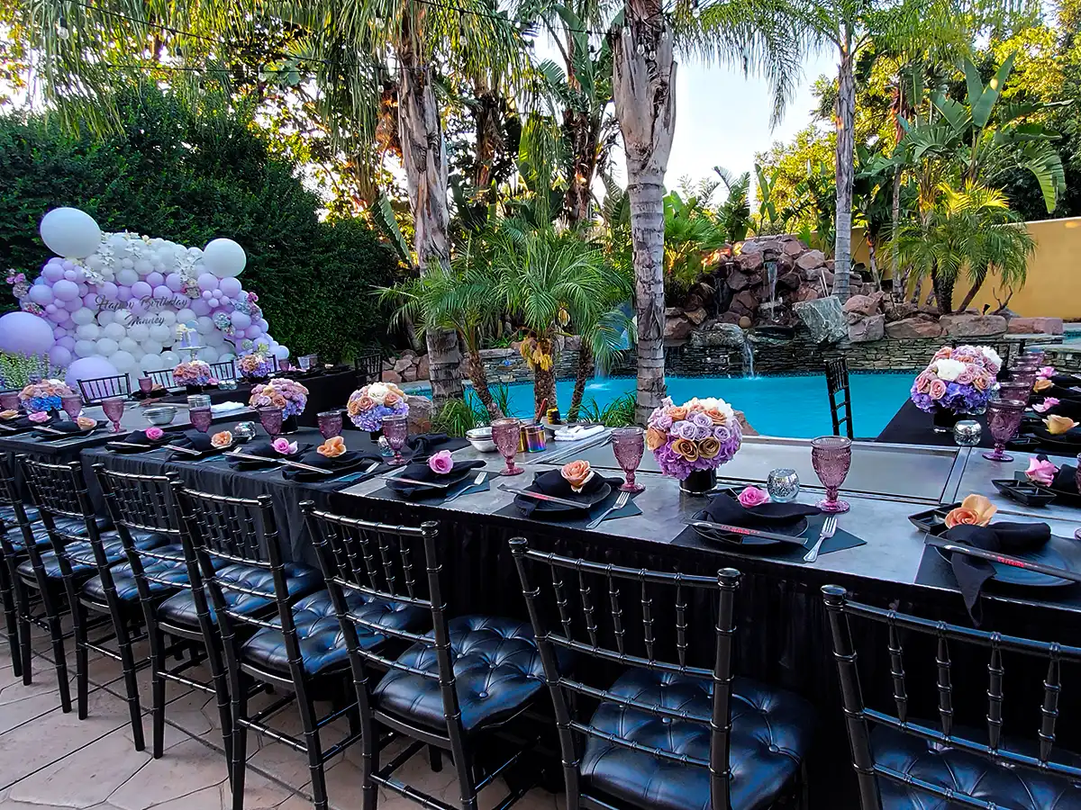 Chef cooking hibachi at a private event with full table setup